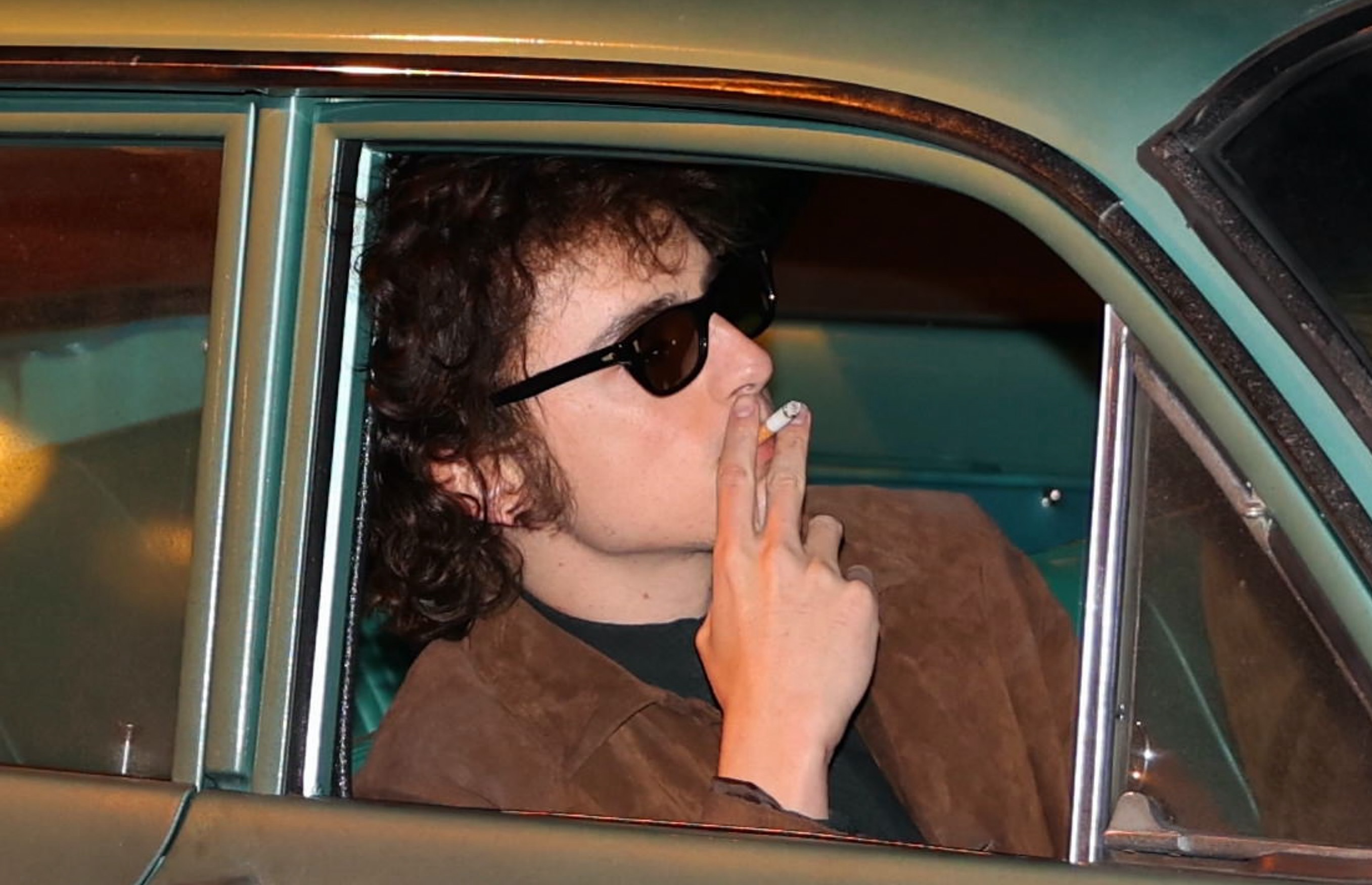 Timothee Chalamet Smokes a Cigarette on Bob Dylan Movie Set: Video