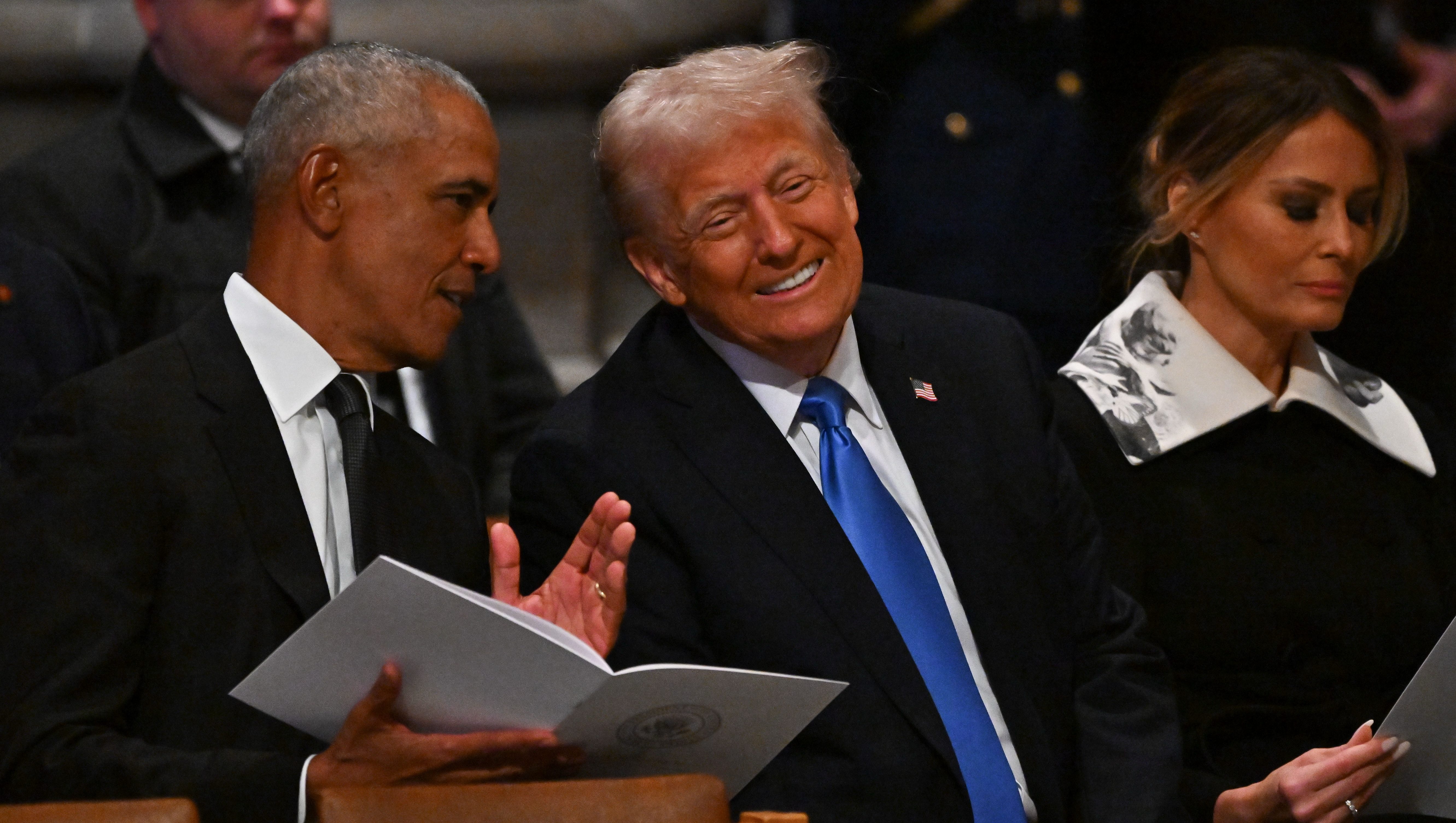 What Were Trump & Obama Talking About at Carter’s Funeral? Photos